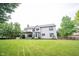 Spacious back exterior showcasing a well-maintained yard, deck area, and the home's architectural design at 9127 Pointe Ct, Fishers, IN 46037