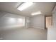 Open basement area featuring neutral carpet, gray paint, and access to additional living space for flexible use at 9127 Pointe Ct, Fishers, IN 46037