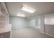 Partially finished basement with gray walls, neutral carpet and an open layout for multiple possible uses at 9127 Pointe Ct, Fishers, IN 46037