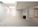Spacious finished basement featuring gray carpet, white trim, and recessed lighting at 9127 Pointe Ct, Fishers, IN 46037