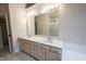 Bathroom with double vanity, large mirrors, modern lighting, and garden tub at 9127 Pointe Ct, Fishers, IN 46037