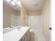 Bright bathroom featuring a white vanity, mirror, and tub with shower at 9127 Pointe Ct, Fishers, IN 46037