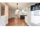 Sun-lit dining area features hardwood floors and is adjacent to the kitchen and features white cabinetry at 9127 Pointe Ct, Fishers, IN 46037