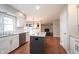 Bright kitchen features a center island with granite counters, stainless steel appliances, and white cabinetry at 9127 Pointe Ct, Fishers, IN 46037