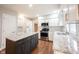 Stylish kitchen with white cabinets, granite countertops, stainless steel appliances, and a central island at 9127 Pointe Ct, Fishers, IN 46037