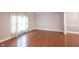 Bright living room featuring hardwood floors and ample natural light from the window at 9127 Pointe Ct, Fishers, IN 46037
