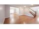 Spacious living room boasting hardwood floors, staircase and an open floor plan at 9127 Pointe Ct, Fishers, IN 46037