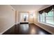Bright living room featuring hardwood floors, large window and an open view to the kitchen at 9127 Pointe Ct, Fishers, IN 46037