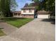 Charming two-story home features an attached garage and a well-maintained front yard at 9210 Brantford Ct, Indianapolis, IN 46260