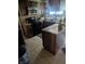 Functional kitchen with tile flooring, wood cabinets, and modern black appliances at 9210 Brantford Ct, Indianapolis, IN 46260