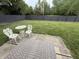 Private backyard with a patio area, stylish outdoor rug, and wrought iron table set perfect for relaxing at 9277 Embers Way, Indianapolis, IN 46250