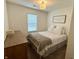 Bright bedroom with a comfortable bed, wooden dresser, and cozy décor at 9277 Embers Way, Indianapolis, IN 46250