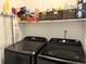 Functional laundry area with modern, front-load washer and dryer at 9277 Embers Way, Indianapolis, IN 46250