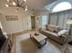 Bright and airy living room with neutral decor, modern lighting, and open layout, perfect for entertaining at 9277 Embers Way, Indianapolis, IN 46250