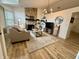 Bright and airy living room with hardwood floors, neutral decor, and stone fireplace focal point at 9277 Embers Way, Indianapolis, IN 46250