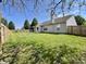 Large backyard with a well-maintained lawn and wood fence at 948 Kitner Ave, Avon, IN 46123