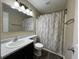 Well-lit bathroom with a vanity, toilet, mirror, and shower-tub combo features modern fixtures at 948 Kitner Ave, Avon, IN 46123