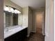 Bathroom features dual sinks, modern lighting, walk-in shower, and tile flooring at 948 Kitner Ave, Avon, IN 46123
