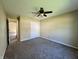 Spacious carpeted bedroom with a ceiling fan and closet offers ample room at 948 Kitner Ave, Avon, IN 46123