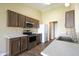 Modern kitchen with stainless steel appliances, granite countertops, and wood cabinetry at 948 Kitner Ave, Avon, IN 46123