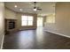 Open living room featuring a brick fireplace, ceiling fan, and sliding glass doors at 948 Kitner Ave, Avon, IN 46123