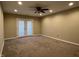 Spacious room features plush carpeting, recessed lighting, ceiling fan, and access to the outside through glass doors at 948 Kitner Ave, Avon, IN 46123