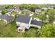 Expansive backyard with a deck, playset, lush lawn, and mature trees, offering privacy and space at 10144 Water Crest Dr, Fishers, IN 46038