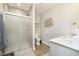 Modern bathroom with a tiled walk-in shower, sleek fixtures, and a decorative art piece at 10144 Water Crest Dr, Fishers, IN 46038