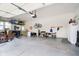 Organized two-car garage with overhead storage, wall-mounted racks, and various items stored neatly at 10144 Water Crest Dr, Fishers, IN 46038