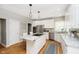 Bright kitchen featuring white cabinetry, stainless steel appliances, granite countertops, and a center island at 10144 Water Crest Dr, Fishers, IN 46038