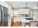 Bright kitchen features stainless steel appliances, granite countertops, and ample cabinet space at 10144 Water Crest Dr, Fishers, IN 46038