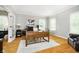 Spacious home office with hardwood floors, a large desk, and natural light from the windows at 10144 Water Crest Dr, Fishers, IN 46038