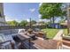 Expansive backyard deck with outdoor seating and string lights overlooking a spacious yard at 1132 Evison St, Indianapolis, IN 46203