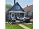 Backyard deck with outdoor seating, a grill, and string lights, perfect for entertaining at 1132 Evison St, Indianapolis, IN 46203