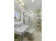 Bright bathroom featuring a walk-in shower, stylish vanity and a decorative white framed mirror at 1132 Evison St, Indianapolis, IN 46203