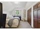Bright bedroom featuring a large bed, dresser and closet space at 1132 Evison St, Indianapolis, IN 46203