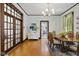 Elegant dining room with hardwood floors, a chandelier, and craftsman trim details throughout at 1132 Evison St, Indianapolis, IN 46203