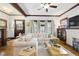 Inviting living room with hardwood floors, original trim, a white sofa, and natural light at 1132 Evison St, Indianapolis, IN 46203