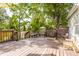 Large back deck with wooded view featuring a fire pit and outdoor seating at 11419 Niagara Dr, Fishers, IN 46037