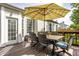 Back deck area featuring outdoor seating with a colorful umbrella at 11419 Niagara Dr, Fishers, IN 46037