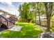 Well-maintained backyard with lush green grass and a stone path at 11419 Niagara Dr, Fishers, IN 46037
