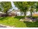 Expansive backyard with a wooden deck, mature trees, and meticulously arranged landscaping for peaceful outdoor enjoyment at 11419 Niagara Dr, Fishers, IN 46037