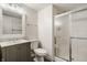 Bathroom featuring shower with glass door, sleek vanity, and toilet at 11419 Niagara Dr, Fishers, IN 46037