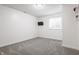Bright and airy bedroom with gray carpet and a mounted television at 11419 Niagara Dr, Fishers, IN 46037