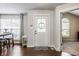 Welcoming foyer featuring a decorative front door, wood flooring, and access to other rooms at 11419 Niagara Dr, Fishers, IN 46037