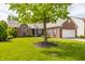 Beautiful brick home with lush green lawn and mature tree providing ample shade at 11419 Niagara Dr, Fishers, IN 46037