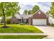 Charming brick home with a manicured lawn and attached two-car garage in a desirable neighborhood at 11419 Niagara Dr, Fishers, IN 46037