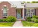 Charming front porch with a decorative wreath on the door and lovely landscaping at 11419 Niagara Dr, Fishers, IN 46037