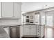 Kitchen featuring stainless steel appliances, ample white cabinetry and a convenient breakfast bar open to the living area at 11419 Niagara Dr, Fishers, IN 46037