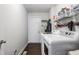 Clean, white laundry room with washer and dryer units at 11419 Niagara Dr, Fishers, IN 46037